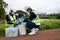 Environmental Engineers Team Take Water Samples at Natural Water Sources. Water that smells bad Near Farmland, Fish Ponds May Be