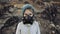 Environmental pollution, disaster, nuclear war concept. Child in protective mask