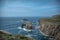 Enys Dodnan arch on a summer day Lands End Cornwall England