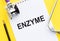 ENZYME word write on medical notebook with stethoscope