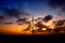 Eolian park at sunset with clouds and red sky