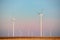 Eolian turbines park at sunet, warm light. Wind power concept