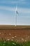 Eolian wind turbine on cultivated field
