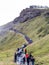 Eople on path to viewpoint of Gullfoss waterfall