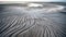 Ephemeral Sand Patterns: Rhythmic Linear Formations On The Shoreline