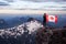 Epic Adventurous Extreme Composite of Girl Holding a Canadian Flag