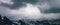Epic Aerial Alpine Panorama with Dramatic Clouds