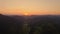 Epic aerial flight over mist forrest sunset