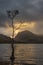 Epic Autumn sunrise landscape image of Buttermere in Lake District with dramatic stormy sky