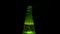 Epic beer bottle opening. the smoke from the beer bottle is slow. drink on black background