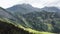 Epic breathtaking aerial background shot of beautiful famous green mountain landscape view in summer Switzerland Alps.