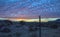 Epic desert Sunrise with barbwire fence in Arizona