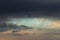 Epic Dramatic Storm sky, dark grey clouds against blue sky background texture, thunderstorm