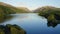 Epic Drone View of Calm Water Lake in Breathtaking Landscape - Aerial