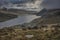 Epic early Autumn Fall landscape of view along Ogwen Valley in Snowdonia National Park under dramatic evening sky with copy space