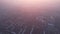 Epic gray smog is visible at sunset over the city