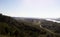 Epic panoramic view from up hill with river and narrow road