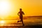 Epic runner training on summer sunset