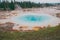 Epic scenic view of colorful steaming pool of geysers in Yellowstone National Park.