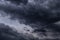 Epic storm sky with dark violet grey black rainy clouds background texture, hurricane with thunderstorm