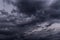 Epic storm sky with dark violet grey black rainy clouds background texture, hurricane with thunderstorm, cyclone