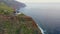 Epic sunset with a lighthouse on the beautiful island of Madeira in Portugal.