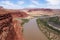 Epic view of Colorado river and Utah desert from Hite Overlook vista point on a very hot, sunny day of spring. Red mesa