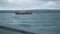 Epic view of fishing toristic boat at north summer Barents sea, stormy weather, waves