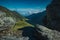 Epic winding road on Transfagarasan pass in Romania in summer time, with twisty road rising up. Road crossing Fagaras mountain