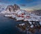 Epic winter seascape from Norway shot at sunrise with dynamic sky and pretty rocks