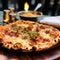 Epicurean Elegance: Round Tarte Flambée Stealing the Spotlight at Bistro