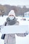 Epidemic of the Chinese coronavirus. A woman in a protective mask with a board