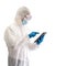 Epidemiological researcher in virus protective clothing pointing at tablet computer monitor