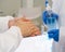 Epidemiological researchers in virus protective clothing washing hands with alcohol gel before beginning the experiment in a