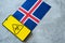 Epidemiological situation in the country Iceland. Flag and smartphone with news and a biohazard symbol.