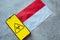 Epidemiological situation in the country Monaco. Flag and smartphone with news and a biohazard symbol.