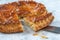 Epiphany Twelfth Night cake french galette des rois made of puff pastry, slice apart with the charm inside,