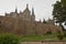 Episcopal Palace Of Gaudi And Cathedral From The Outside Gardens Of The Wall In Astorga. Architecture, History, Camino De Santiago