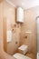 Epmty minimalistic interior background, bathroom of modern apartment, shower cabin, toilet, lavatory, mirror and basin