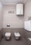 Epmty minimalistic interior background, toilet of modern apartment, lavatory and boiler in light colors