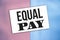 Equal pay words card on pink and baby blue. Gender equality social Concept
