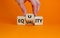 Equality or equity symbol. Businessman turns a cube and changs the word `equality` to `equity`. Beautiful orange background.