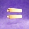 Equals icon. Gold glossy Equals symbol isolated on violet velvet background.