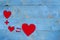 Equation with hearts arranged on blue background