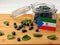 Equatorial Guinea flag on a wooden plank with blueberries isolat