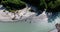 Equestrian group cross a mountain river - drone shot
