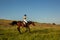 Equestrian sport. Young woman riding horse on dressage advanced test