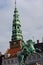 Equestrian statue of Absalon against the tower of St. Nikolaj Church in Copenhagen, Denmark