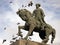 Equestrian statue with flying pigeons