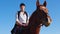 An equestrian woman on horseback